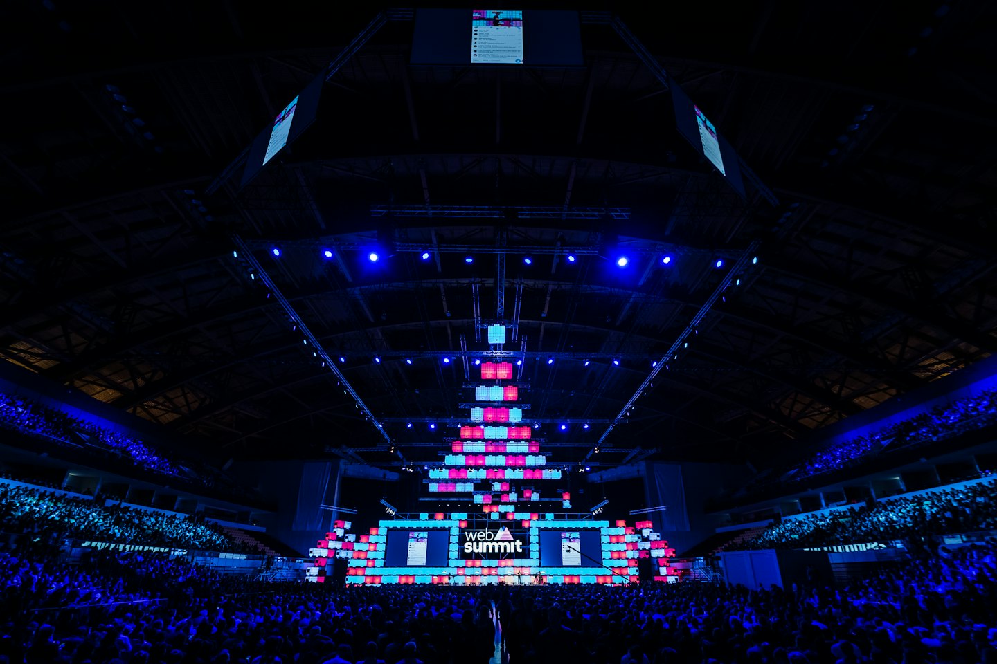 Crowd of people attending a large technology conference.
