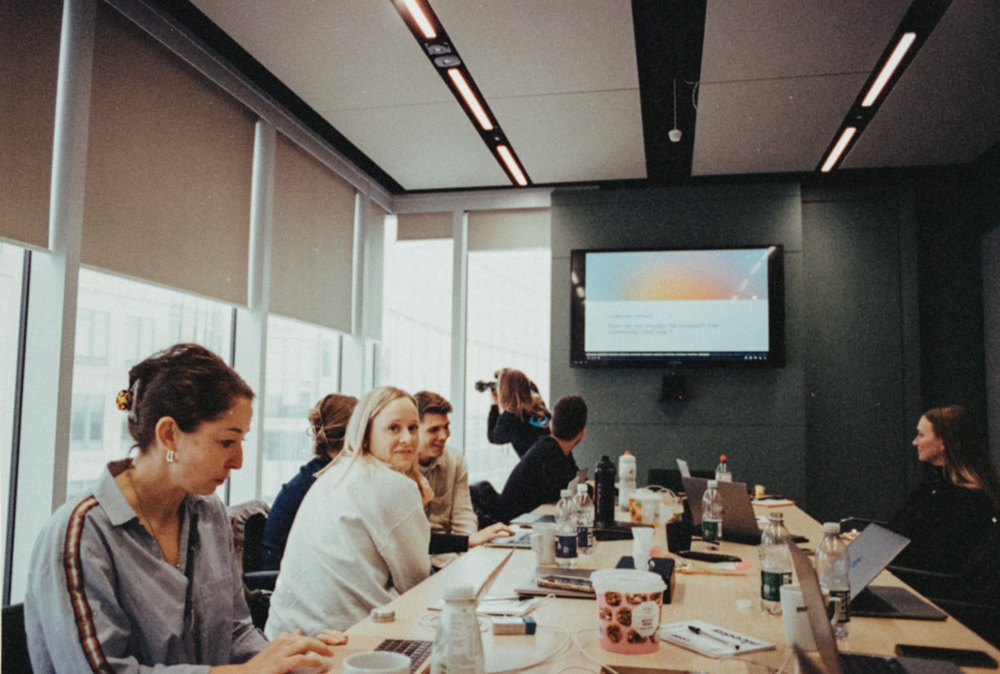 Diverse professionals collaborating around a conference table.